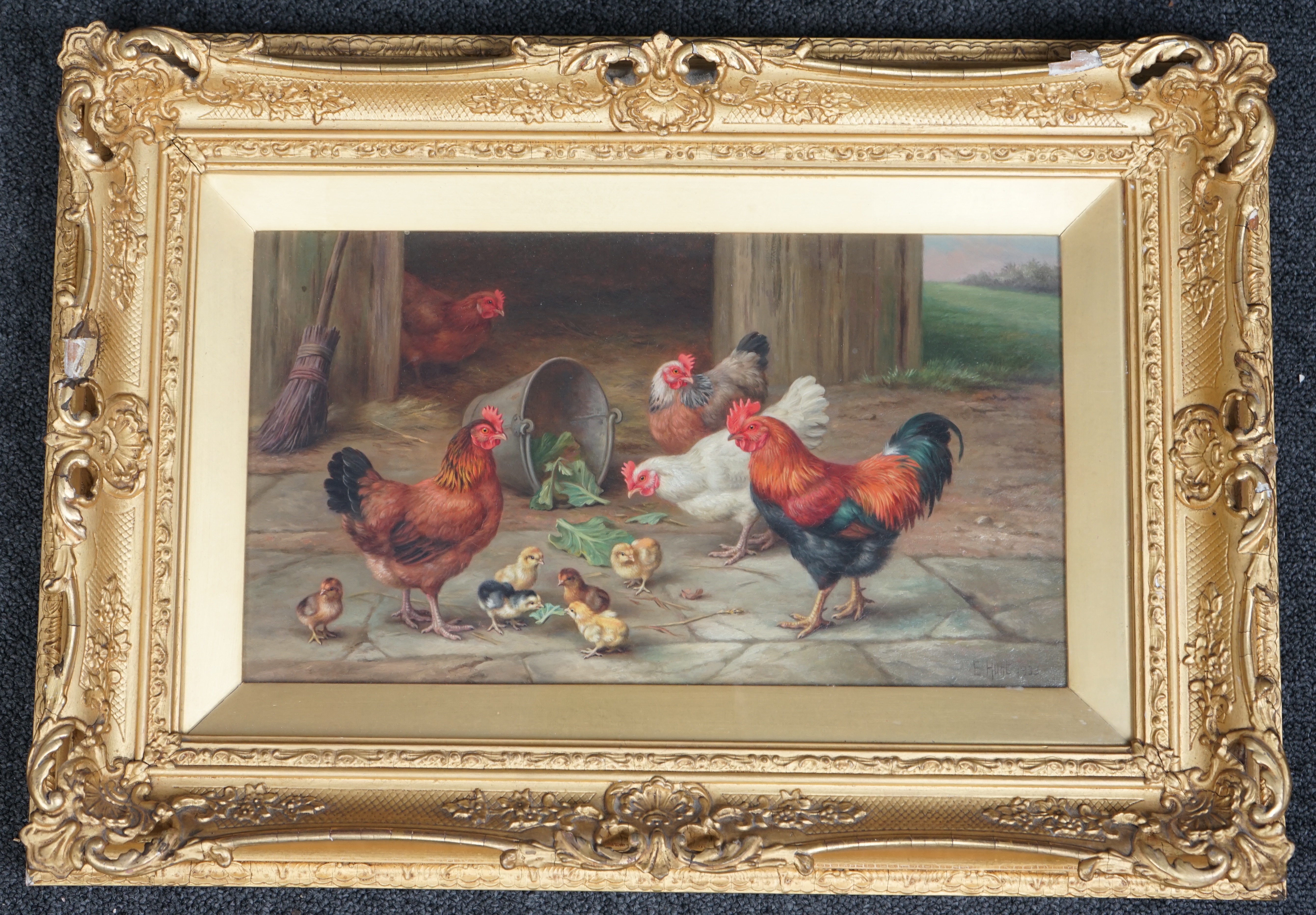 Edgar Hunt (English, 1876-1953), Chickens and chicks in a farmyard, oil on canvas, 19 x 34cm